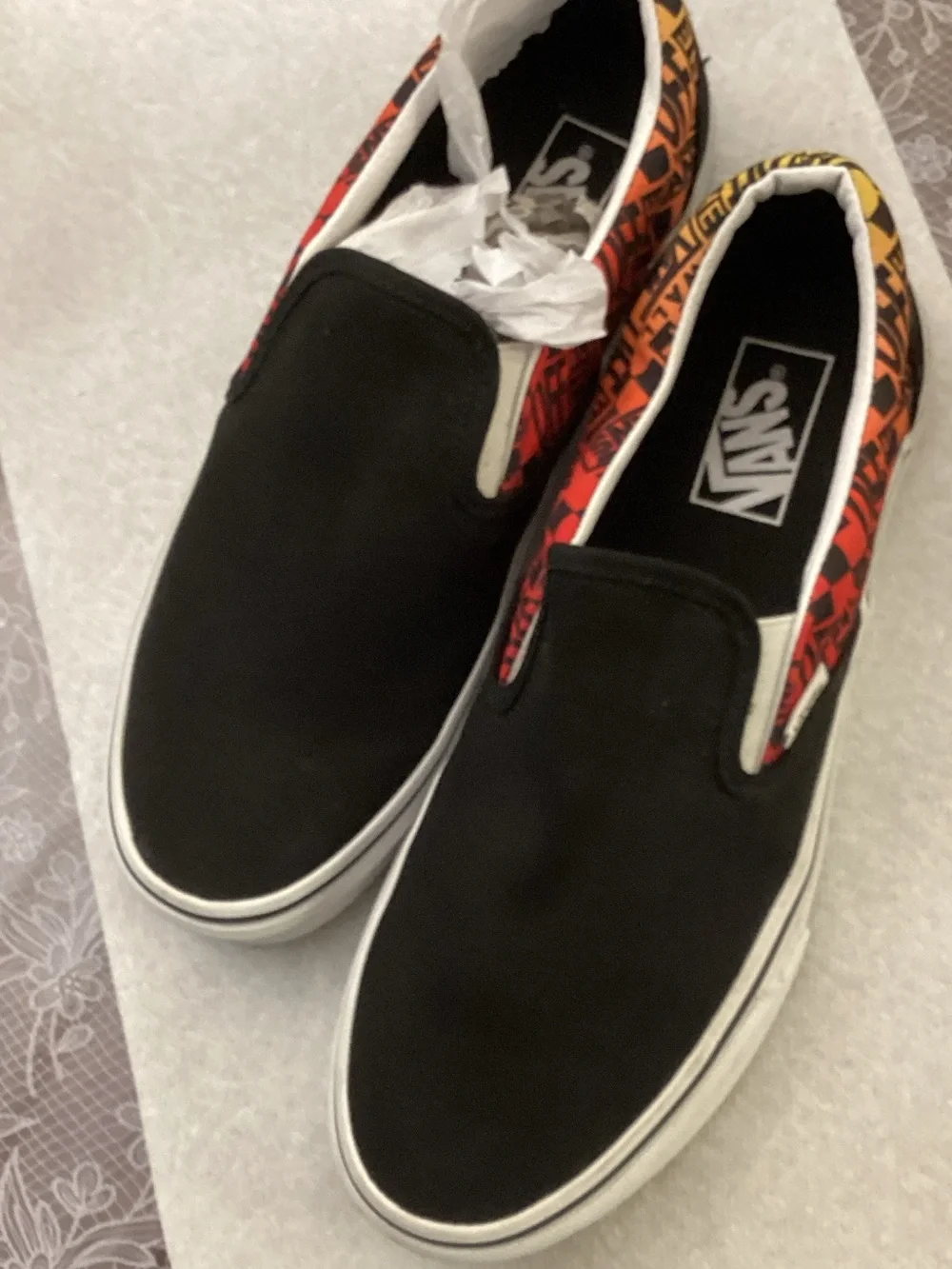 Vans Black Slip-On Loafers with Red and Orange Patterned Collar